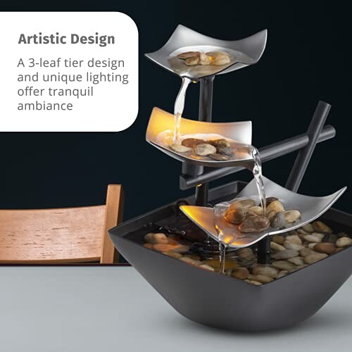 Three-tier indoor water fountain with stones and ambient lighting